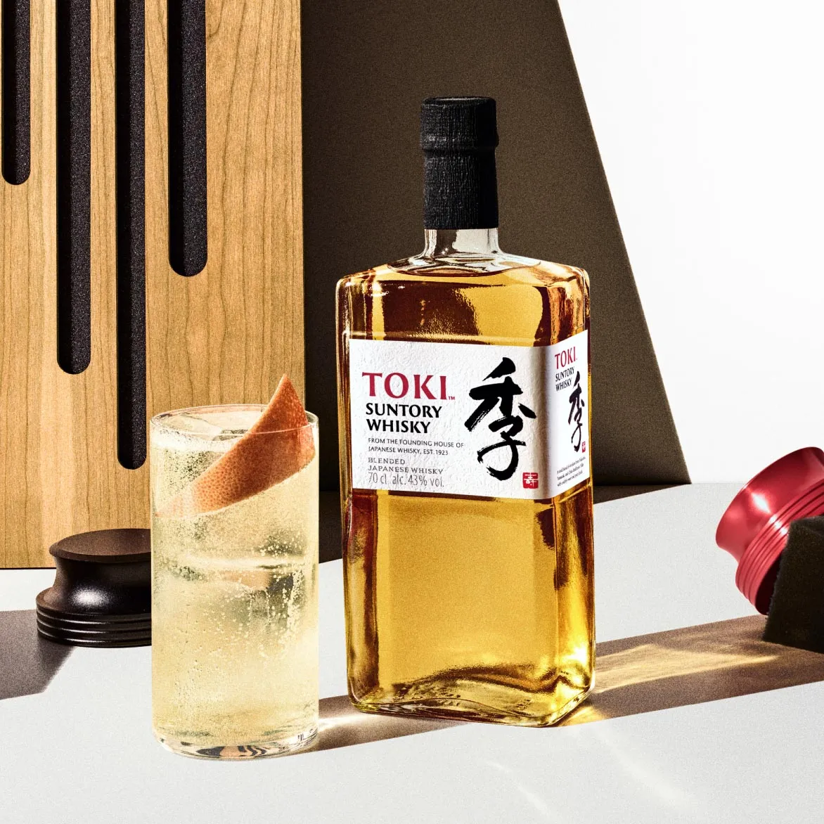 A glass and a bottle of toki.