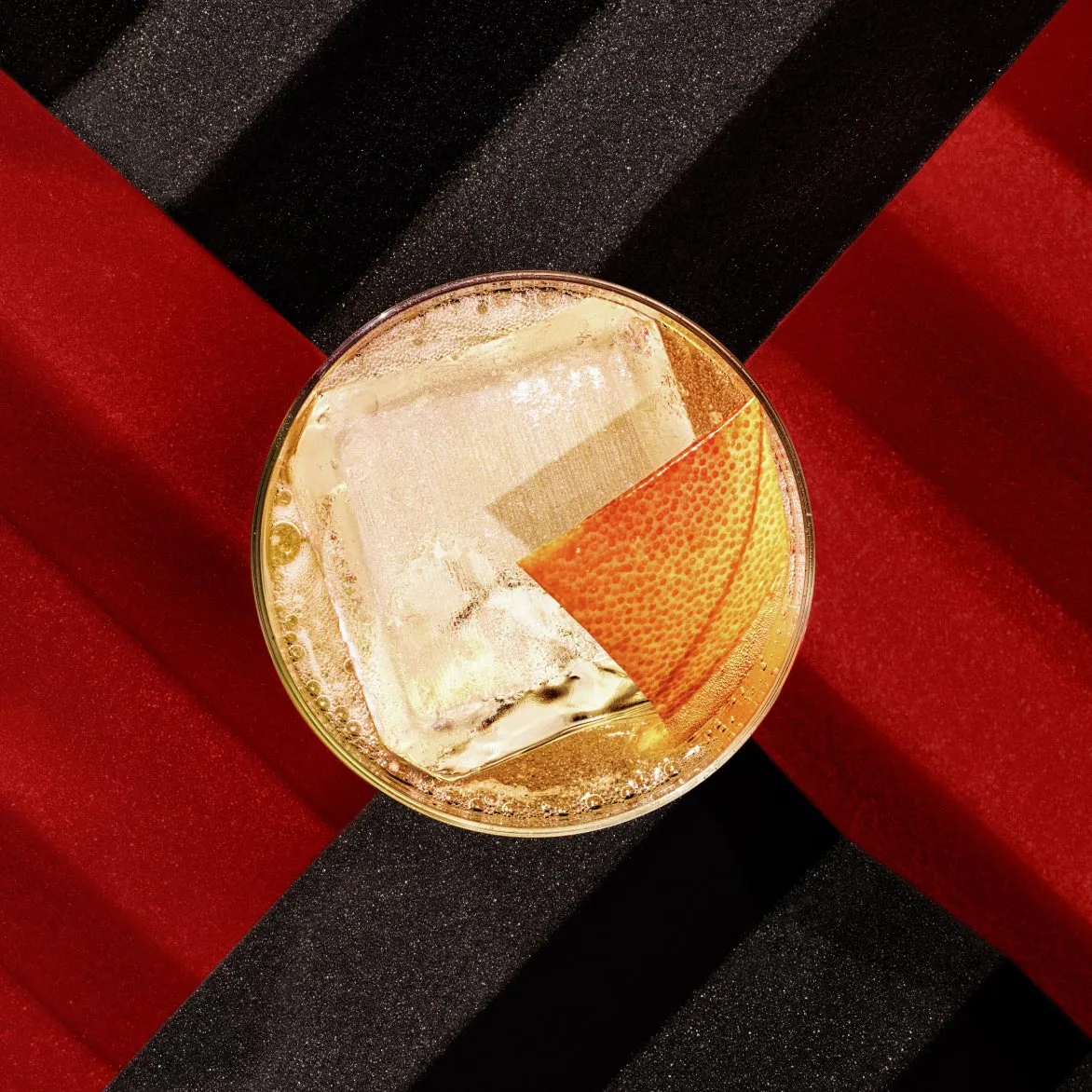 A glass of toki filled with ice cube.